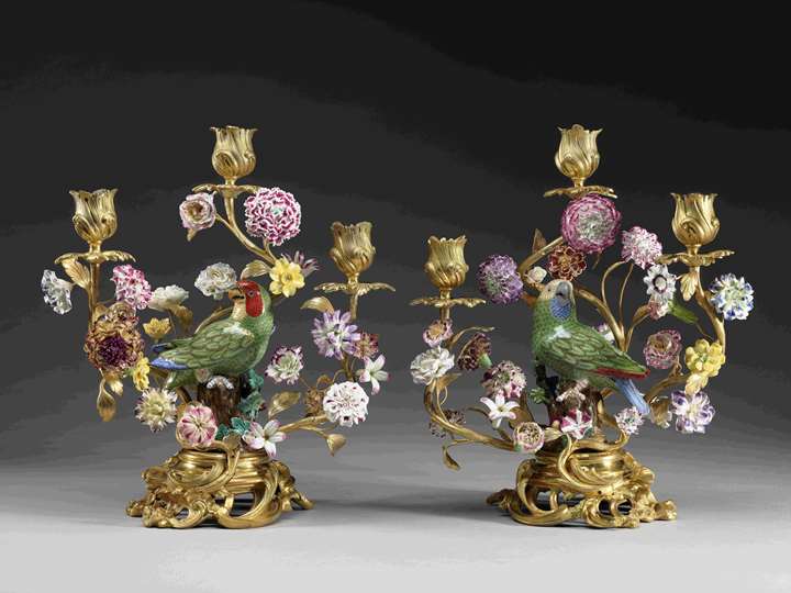 A pair of parrots mounted as three-branch candelabra
